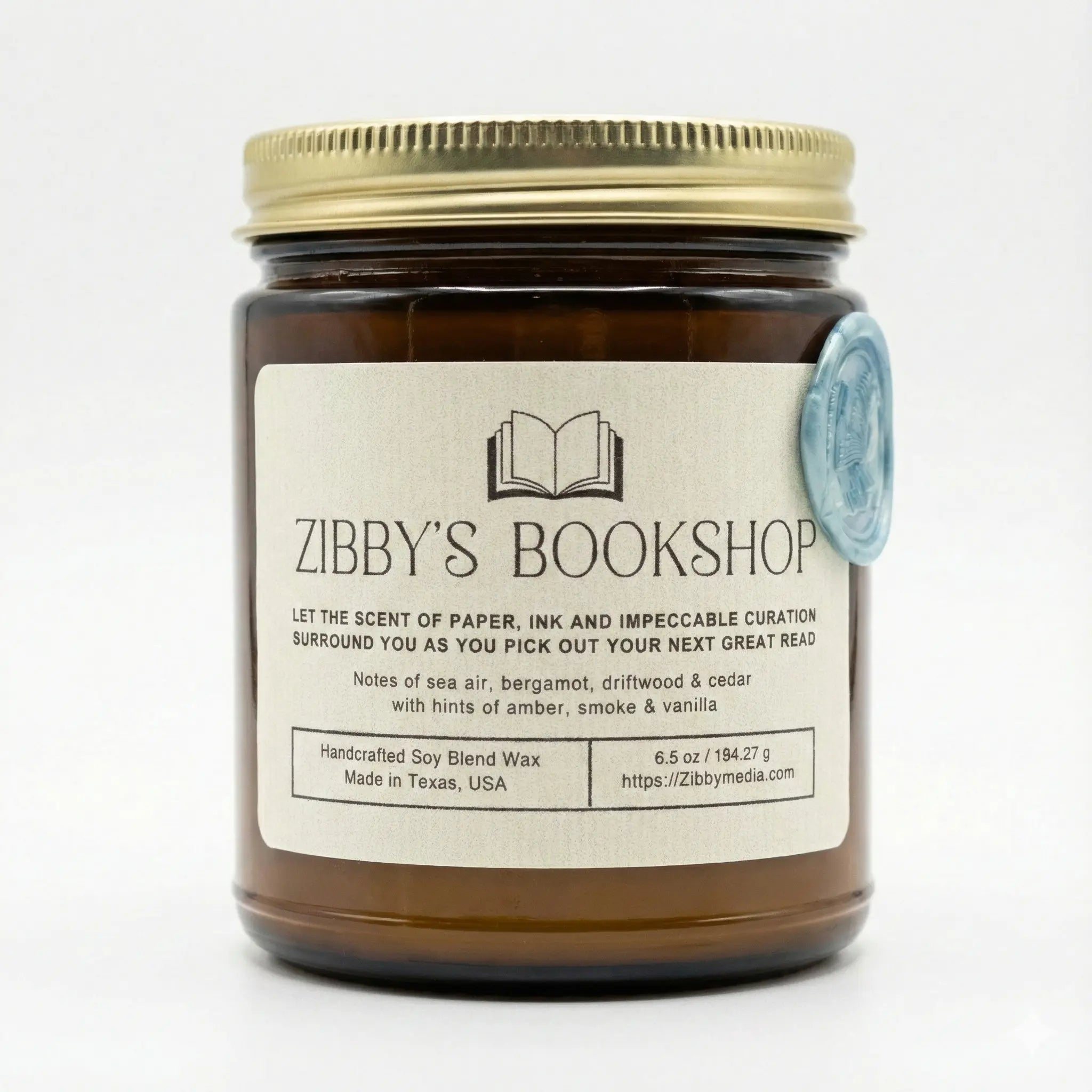 Candle jar with 'Zibby's Bookshop' label on a white background